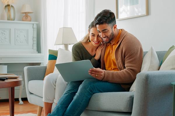 Smiling woman looking at laptop